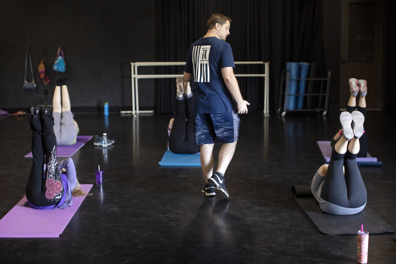 Damien Temperley leads an ab class at Aging Is Cool, an exercise program for older adults.